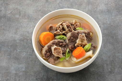 Sop Buntut or Oxtail Soup with carrot and potatoes. Indonesian traditional food