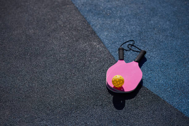 istock Rackets for pickleball lying on the court 1716475057