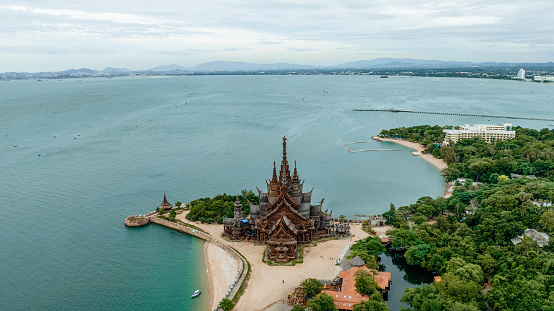 Sanctuary of Truth, Pattaya, Thailand, wooden temple by the ocean during sunset on the beach of Pattaya Chonburi Thailand