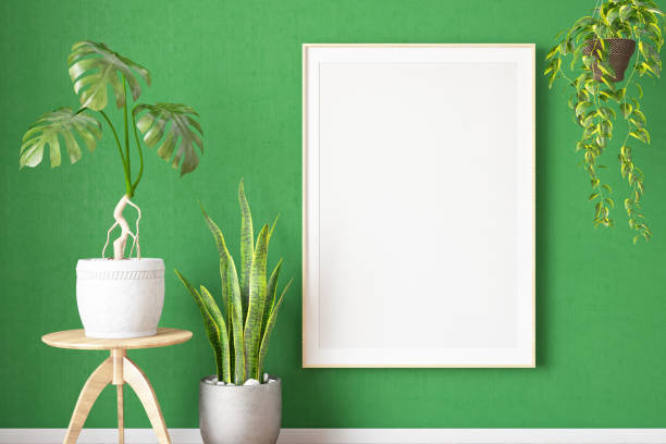 istock Mockup Photo Frame on a Green Wall with Beautiful Plants 1716526057