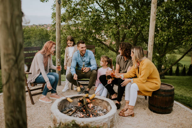 istock Friends having good time and baking corns in the house backyard 1716526065