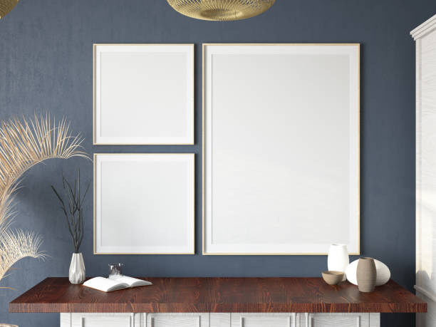 Three Mockup Empty Picture Frames on the Wall with a Wooden Drawer and Accessories