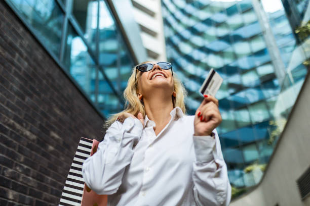 istock Young Woman's Credit Card Adventure 1716536547