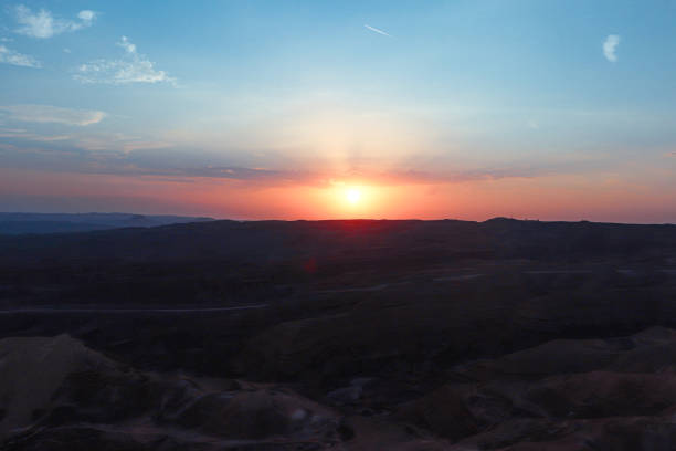 Eilat, Israel sunset off the top of Eilat Mountain range within the southern Negev