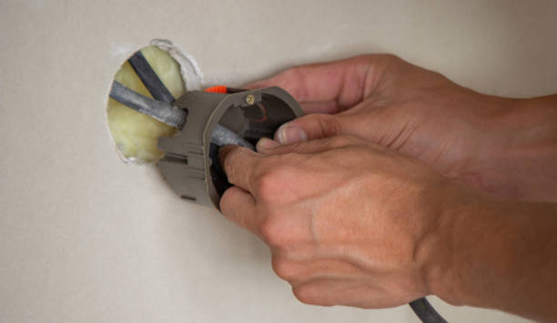 istock an electrician puts sockets in a plasterboard wall. . 1716553161