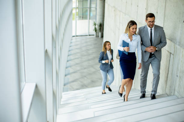 istock Young startup team have a discussion while climbing on  stairs in the office corridor 1716570609