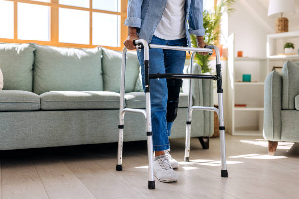 istock Unrecognisable senior woman using mobility walker at home 1716595060