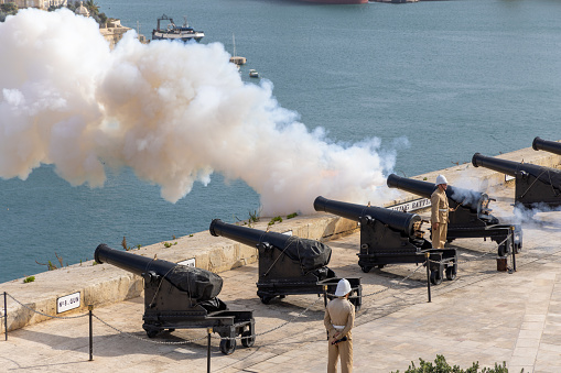 Valetta, Malta - September 23, 2023: Canons firing at Valletta's ancient ceremonial platform. The passage of time is marked twice daily from here with gunfire at noon and 4 pm.