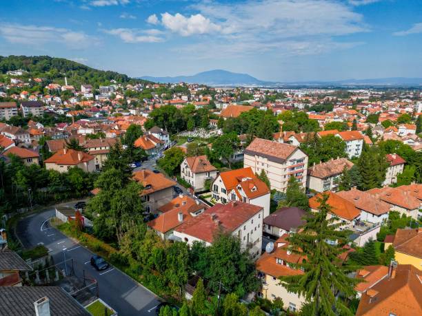 istock a small town with many trees and mountains in the background 1716611663