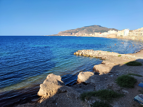 View of the coastline at the historic old town of Trapani on the Mediterranean sea, a city and municipality on the west coast of Sicily, in Italy.