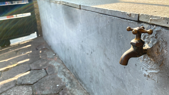 Old and used Vintage faucet, with copy space