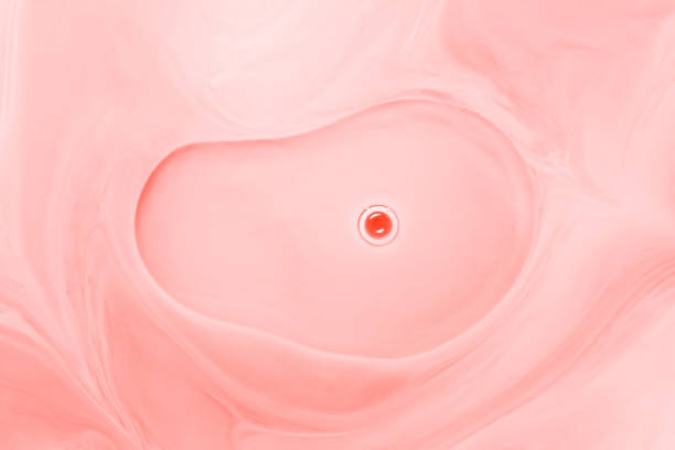 Abstract background made of red paint, milk and oil