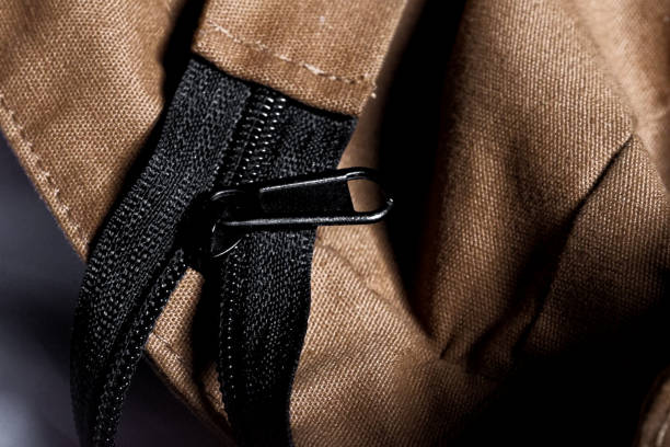 a zipper on a sling bag.