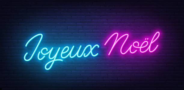 istock Joyeux Noel neon lettering on brick wall background. Merry Christmas greetings in French. 1716642799