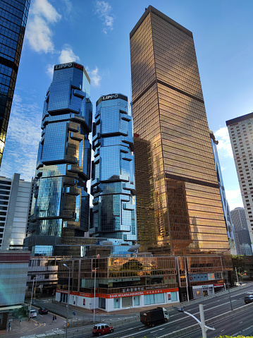 Postmodern Lippo Centre, a twin-tower skyscraper complex, and the golden Far East Financial Center in Admiralty on Hong Kong Island.