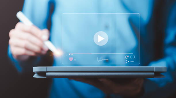 istock man searching for information to watch various videos ,streaming onlinewatching video on internet, live concert, show or tutorial,webinars online business training 1716671413