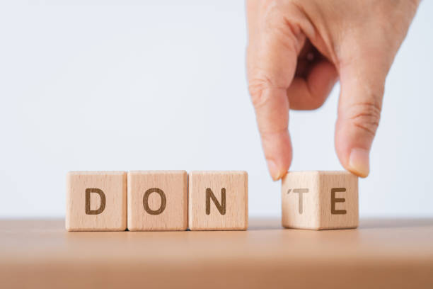 istock Personal development and career growth or change attitude yourself concept. Wood block cube with hand flipped word DON'T to DONE 1716712019