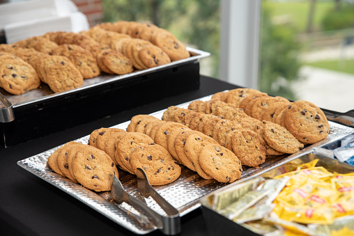 chocolate chip cookies on a plate at a catered event