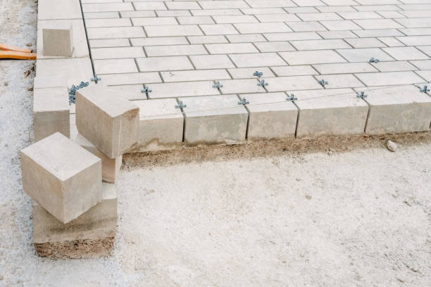 istock Paving a street with stone pavers, construction work in progress. 1716728533