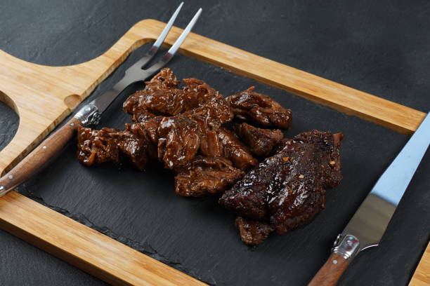 istock Backed diced beef in barbecue sauce. Rustic style 1716728560