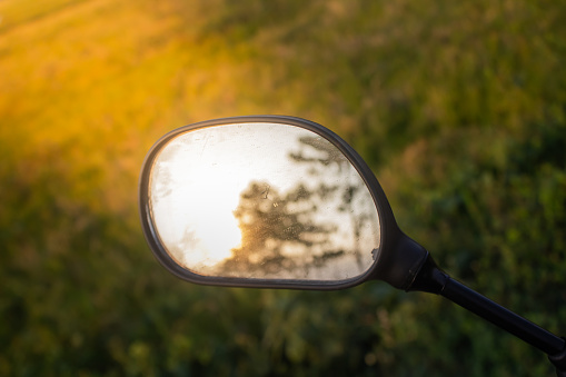Bicycle rearview mirror illuminated by sunlight