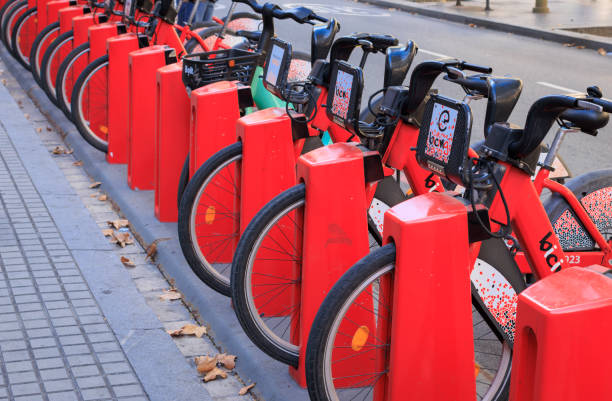 Barcelona, Spain - September 14, 2023: Electric bikes charging up on a street in Barcelona. These bikes are electrically power assisted and are available for hire by members of the public. They have proved popular with tourists and locals.