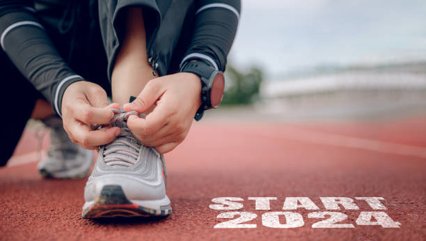 istock Athletes are getting ready to run on the track with text Start 2024 1716753310