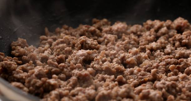 istock Minced meat is fried in a pan with steam. 1716760618