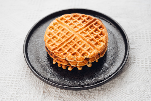 Homemade waffles in a black plate