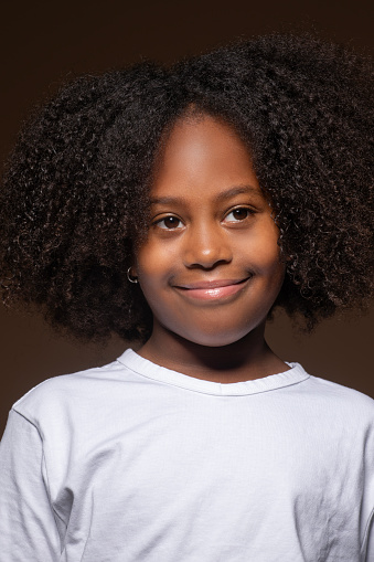 Studio portrait of a  beautiful black female child with natural afro hair