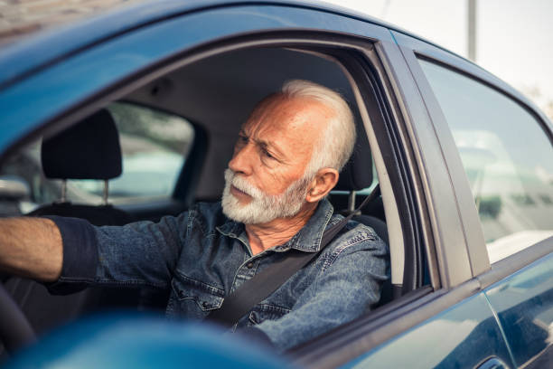 istock Driver's face contorted in rage as somebody offends him in the traffic. 1716798241