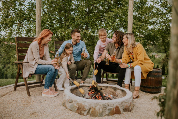 istock Friends having good time and baking corns in the house backyard 1716805986