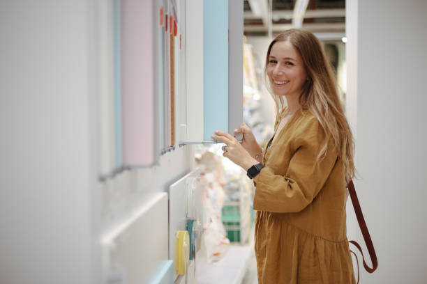 istock Designer choosing materials from samples at interior design shop 1716809495