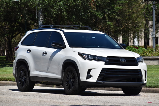 Houston, TX USA 10-1-2023 - A white Toyota SUV cruising near Herman Park in Houston