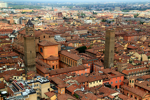 High angle view of the historic part of the city of Bologna with the cathedral and two medieval towers in the center of the photo