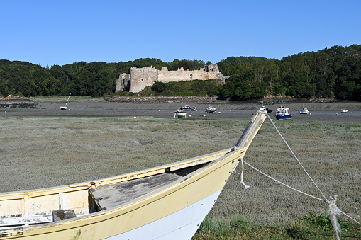 Saint-Cast-le-Guildo, Brittany, France, August 20, 2023 - Guildo castle or Chateau du Guildo on the dry riverbed of the Arguenon, Côtes d'Armor, Brittany.