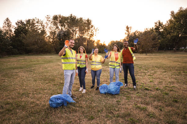 istock Multiracial group of environmentalists waving to the camera 1716822919