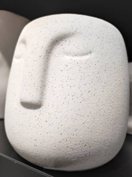 istock Modern flower pot with silent human face 1716826689
