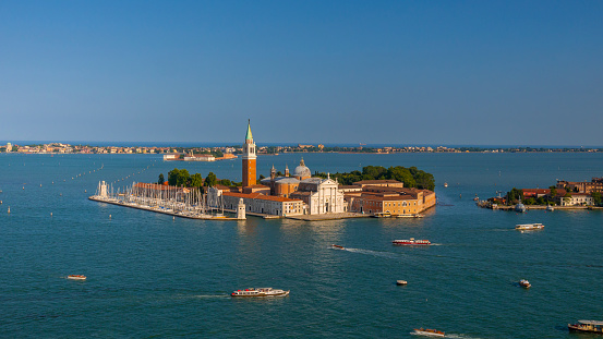 Aerial view of San Giorgio Maggiore is a 16th-century Benedictine church on the island of the same name in Venice, northern Italy, designed by Andrea Palladio, and built between 1566 and 1610.