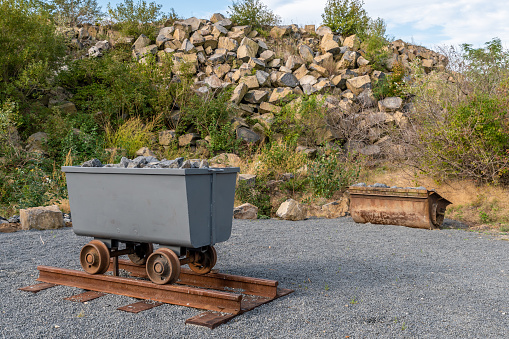 Mine cart full of rocks in an abandoned basalt quarry