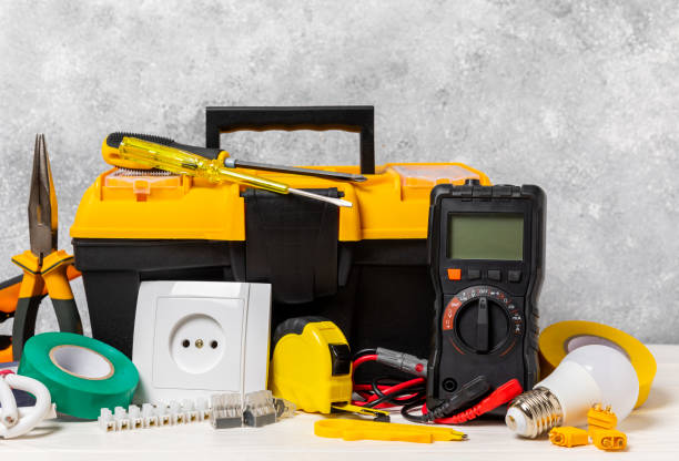 istock Electrician tools on background.Multimeter,construction tape,electrical tape, screwdrivers,pliers,an automatic insulation stripper, socket and LED lamp.Flatley.electrician concept. 1716860460