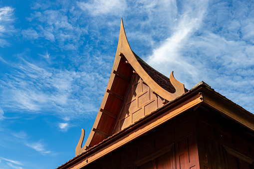 the roof of a Thai style house is a gable style. It has a triangular shape. The roof has a clear height. Good ventilation Helps keep the house cool and comfortable. It is the traditional roof.Blue sky