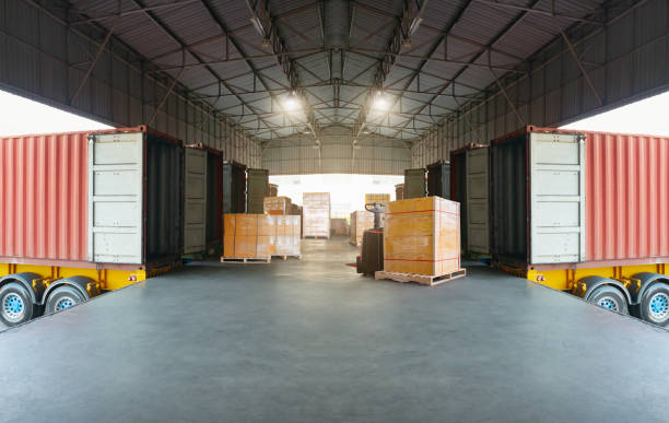 istock Package Boxes Wrapped Plastic Stacked on Pallets. Loading Truck at Dock Warehouse. Cargo Container, Distribution Supplies Warehouse Shipping. Supply Chain, Shipment. Freight Truck Logistic Transport. 1716891952