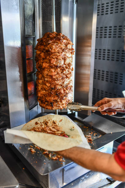 istock Chef Using Food Clamp To Fill Doner 1716893109