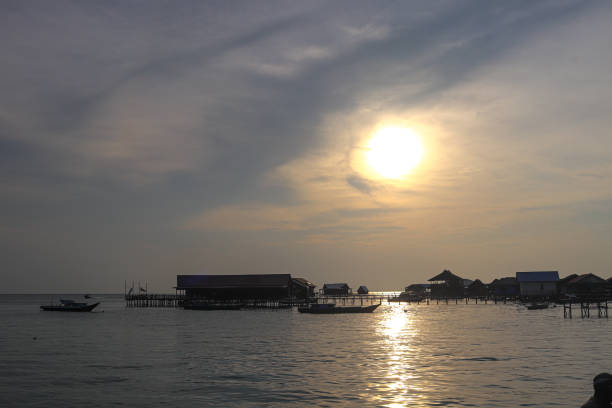 istock in silhouette, sunset photos, beaches 1716893124