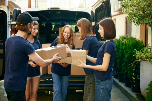 istock Young people, volunteers in uniform loading boxes into van. Gathering food, clothes, meds for people and animals in need 1716898075