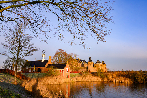 In Muiden, Netherlands the Medieval Muiderslot Castle can be seen along the River Vecht.