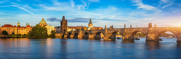 Prague - Charles bridge, Czech Republic. Scenic aerial sunset on the architecture of the Old Town Pier and Charles Bridge over the Vltava River in Prague, Czech Republic.