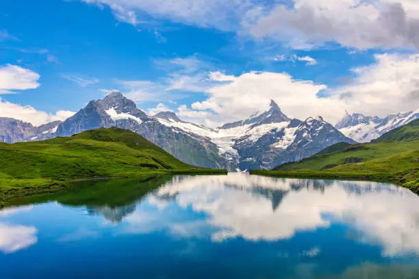 Bachalpsee lake at dawn, Bernese Oberland, Switzerland. Alpine view of the Mt. Schreckhorn and Wetterhorn. Location Bachalpsee in Swiss alps, Grindelwald valley, Interlaken, Europe, Switzerland.