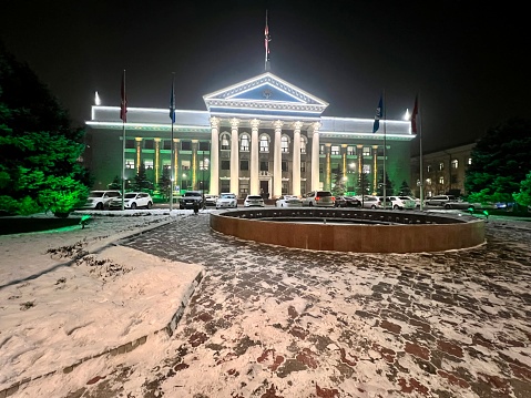 Bishkek, Kyrgyzstan - December 07, 2022: Bishkek Town Hall illuminated at night
